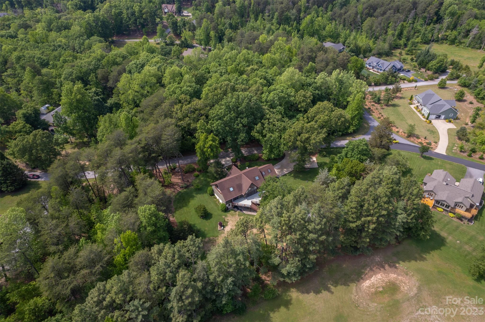 900 Club Road Tryon, NC 28782 - Photo 44 of 48 an aerial view of residential house with outdoor space and lake view