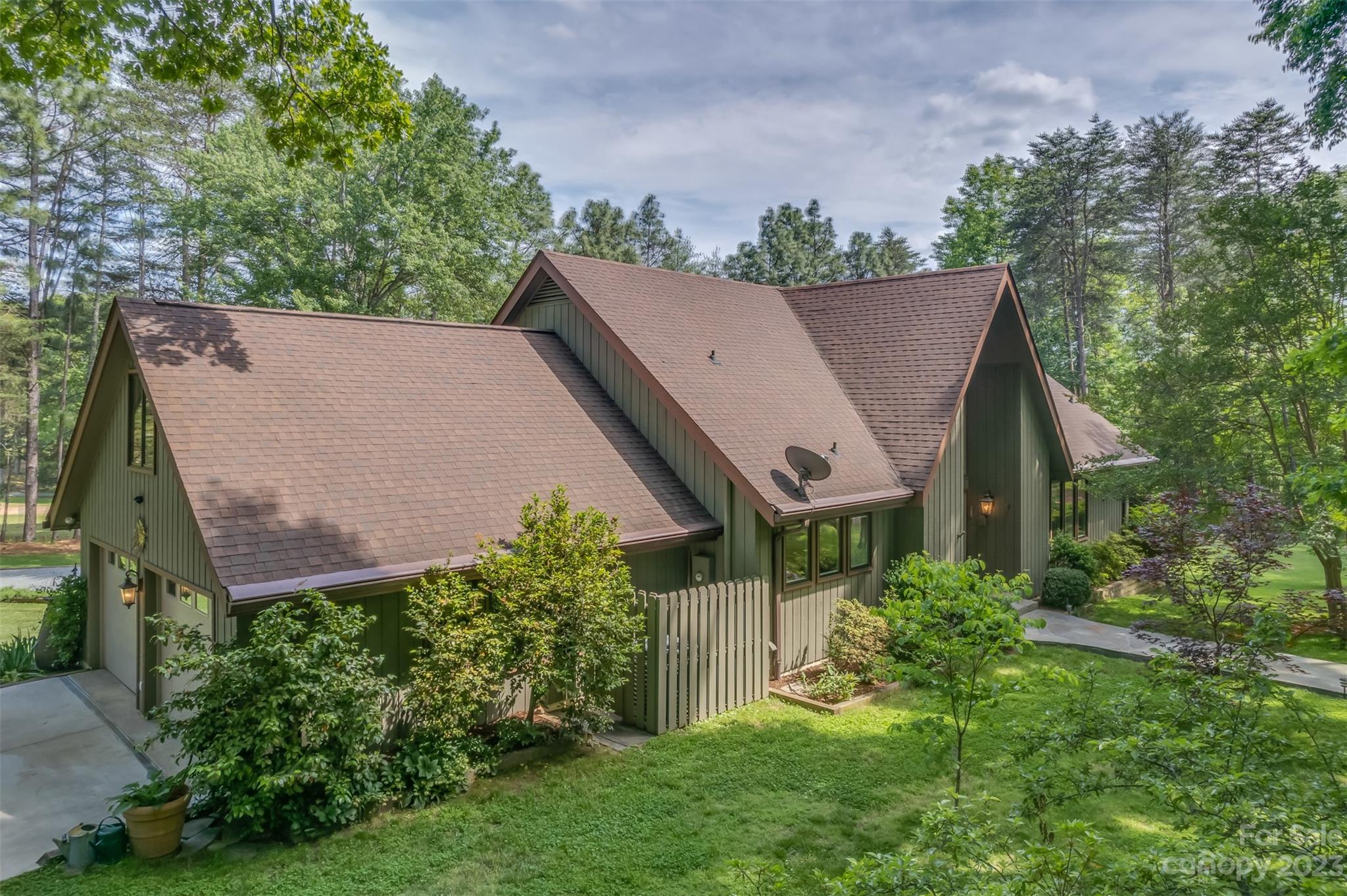 900 Club Road Tryon, NC 28782 - Photo 45 of 48 an aerial view of house with yard and trees in the background
