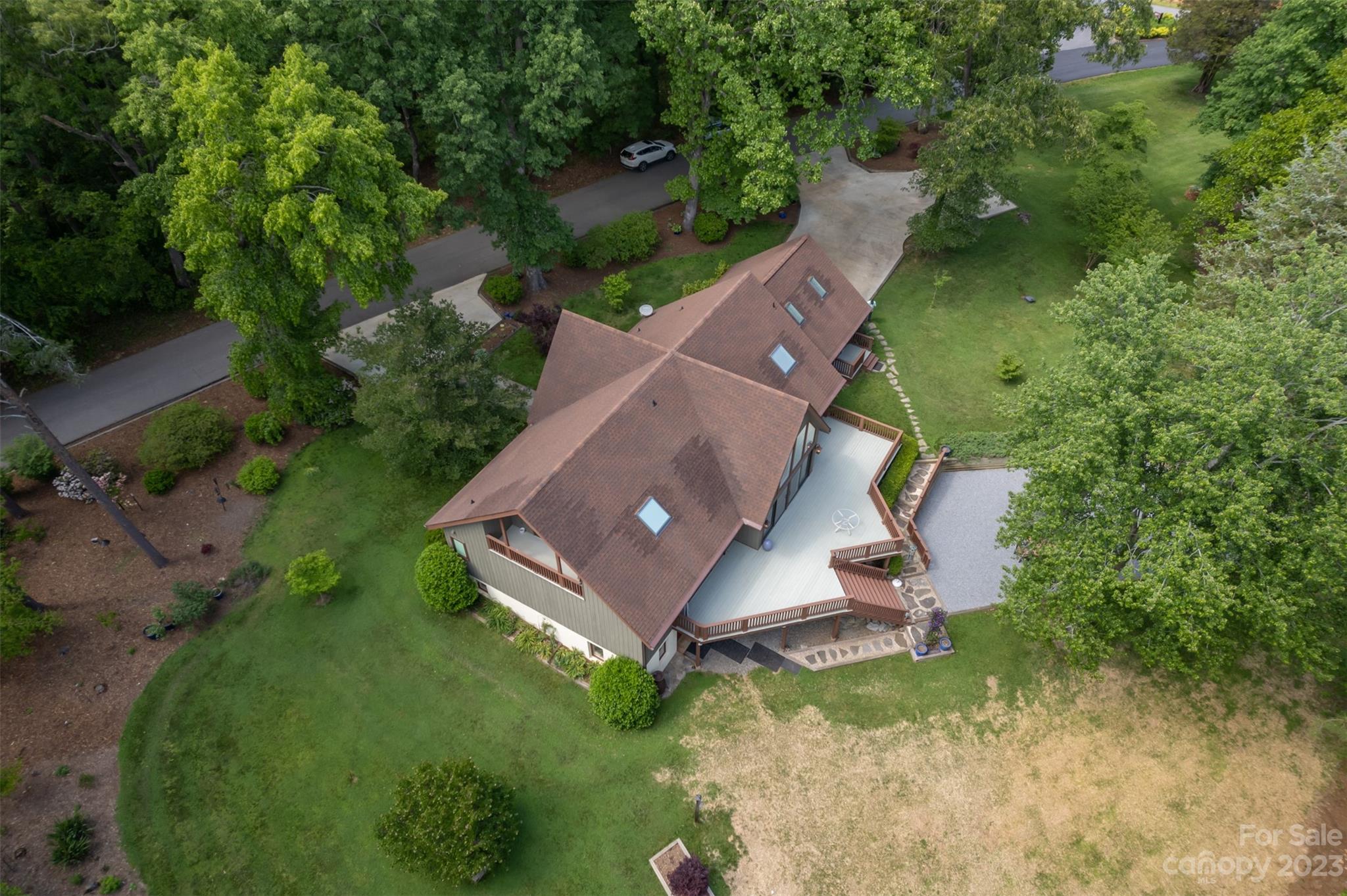 900 Club Road Tryon, NC 28782 - Photo 46 of 48 an aerial view of a house with a yard and trees all around