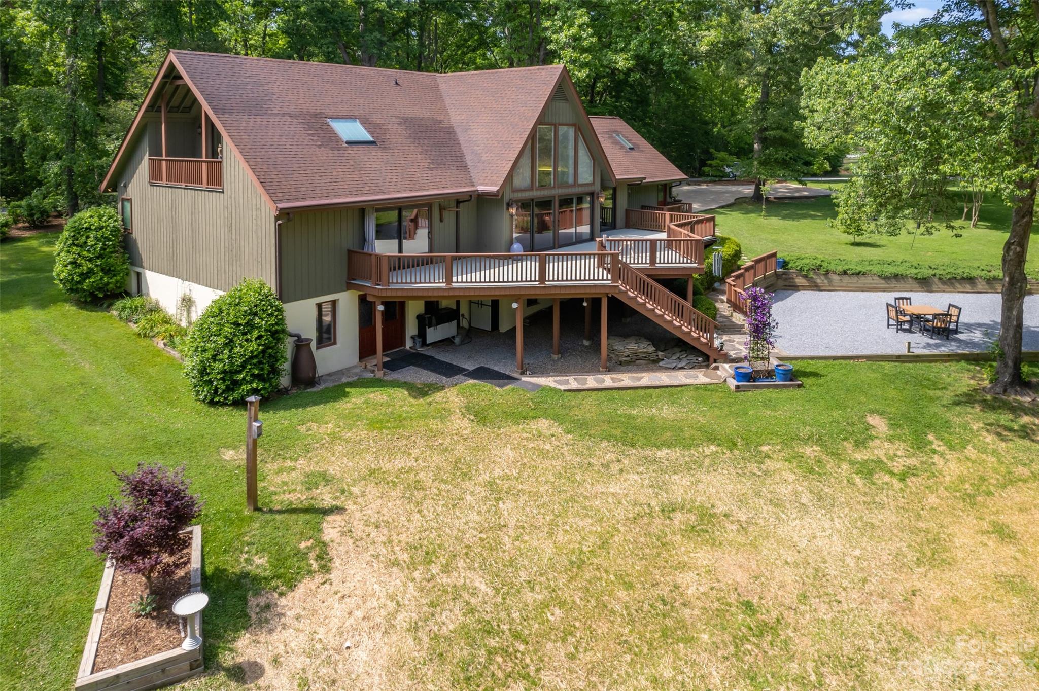 900 Club Road Tryon, NC 28782 - Photo 47 of 48 a aerial view of a house with swimming pool and a yard