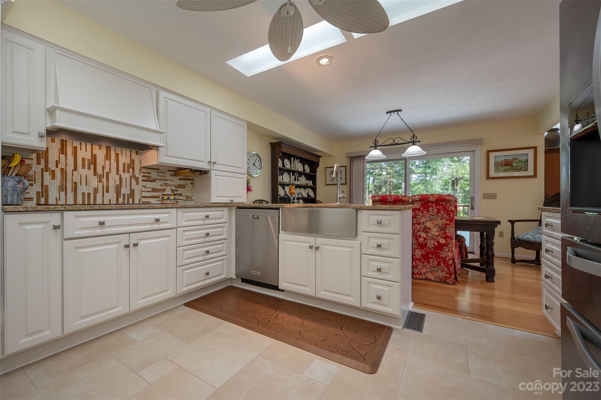 900 Club Road Tryon, NC 28782 - Photo 9 of 48 a kitchen with cabinets and window