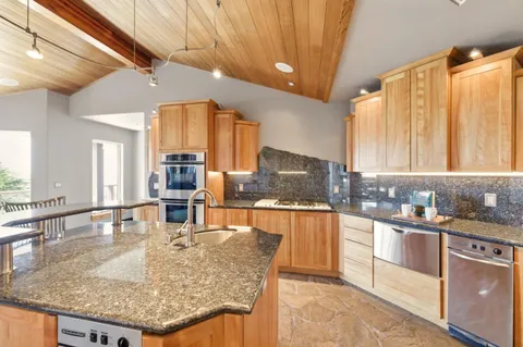a view of a dining room with furniture wooden floor and glass door