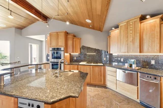 a view of a dining room with furniture wooden floor and glass door
