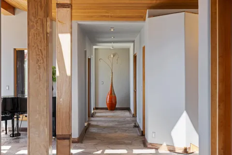 a view of a roof deck with furniture