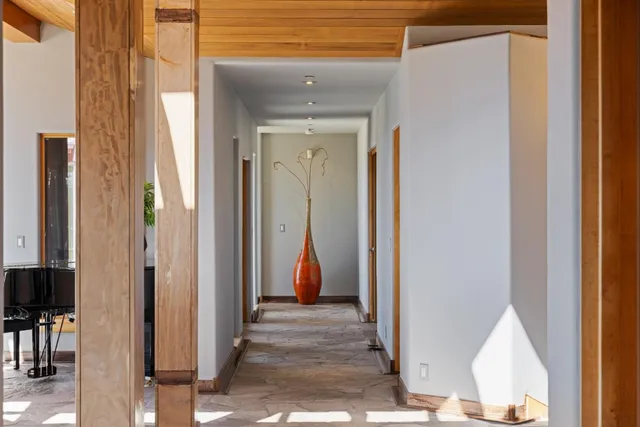 a view of a roof deck with furniture