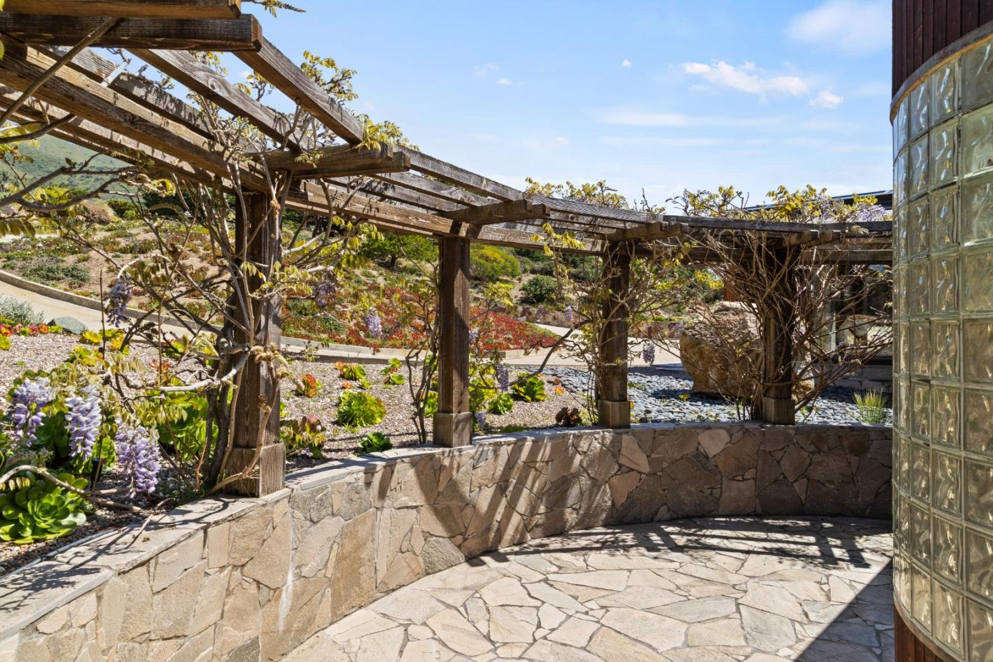 31475 Highway 1 Carmel, CA 93923 - Photo 26 of 43 a view of a swimming pool with a patio