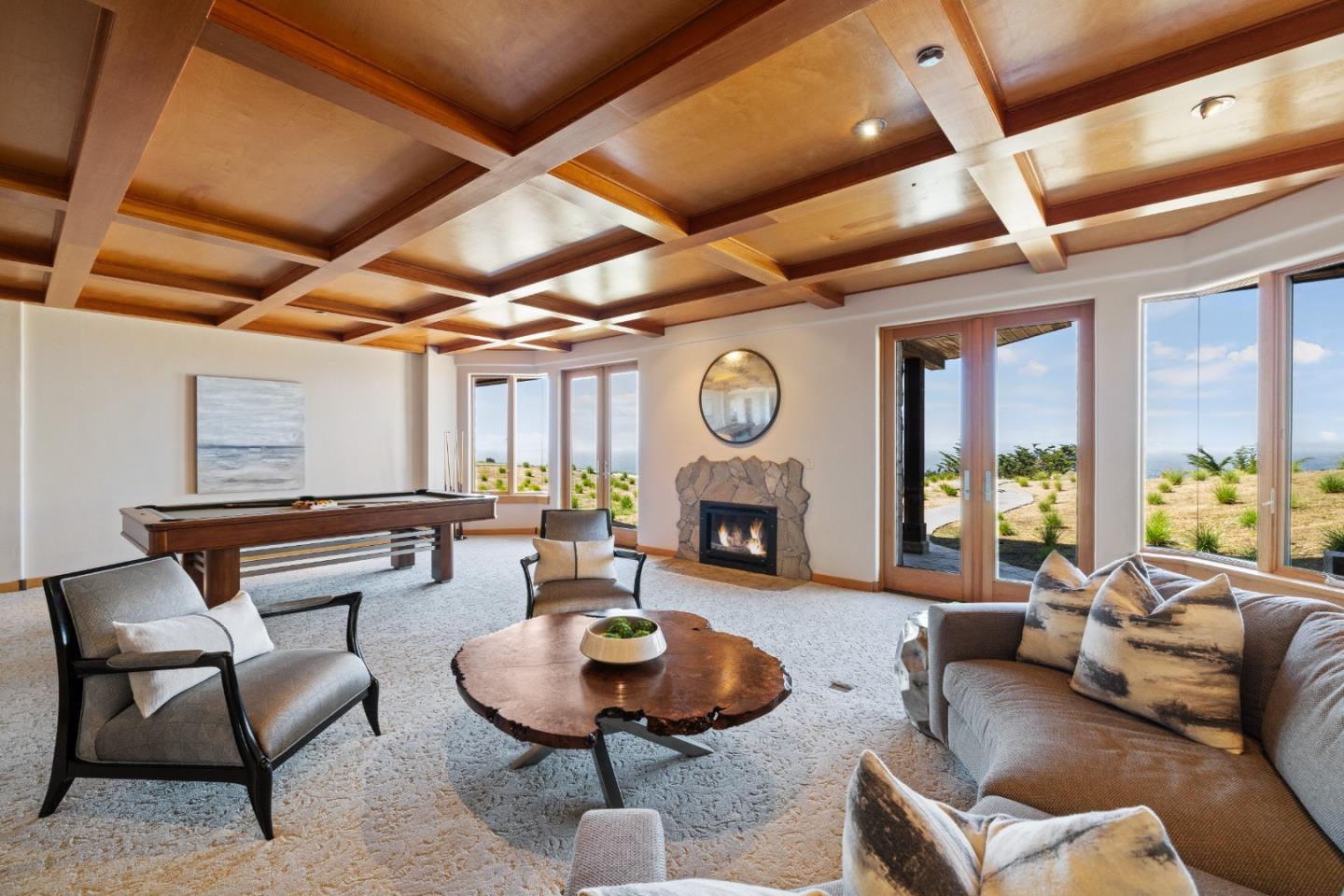 31475 Highway 1 Carmel, CA 93923 - Photo 34 of 43 a living room with furniture a fireplace and a large window