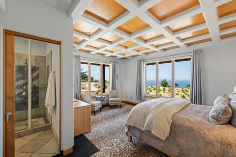 a bathroom with a double vanity sink toilet and shower