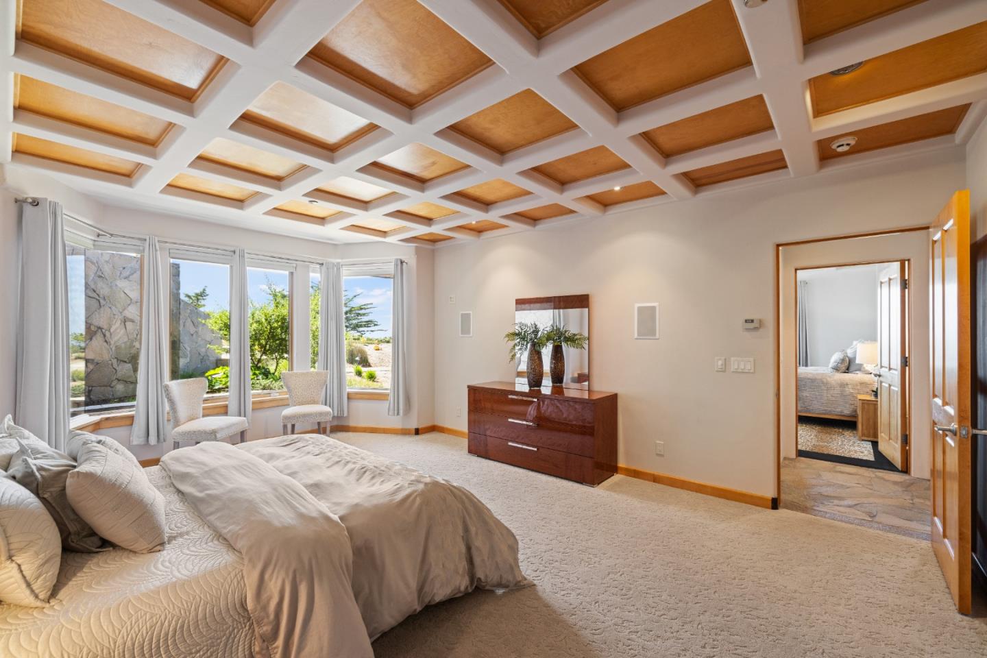 31475 Highway 1 Carmel, CA 93923 - Photo 40 of 43 a bedroom with a bed and wooden floor