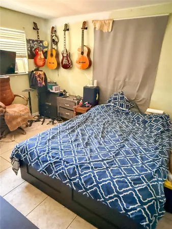 a bed sitting next to a window