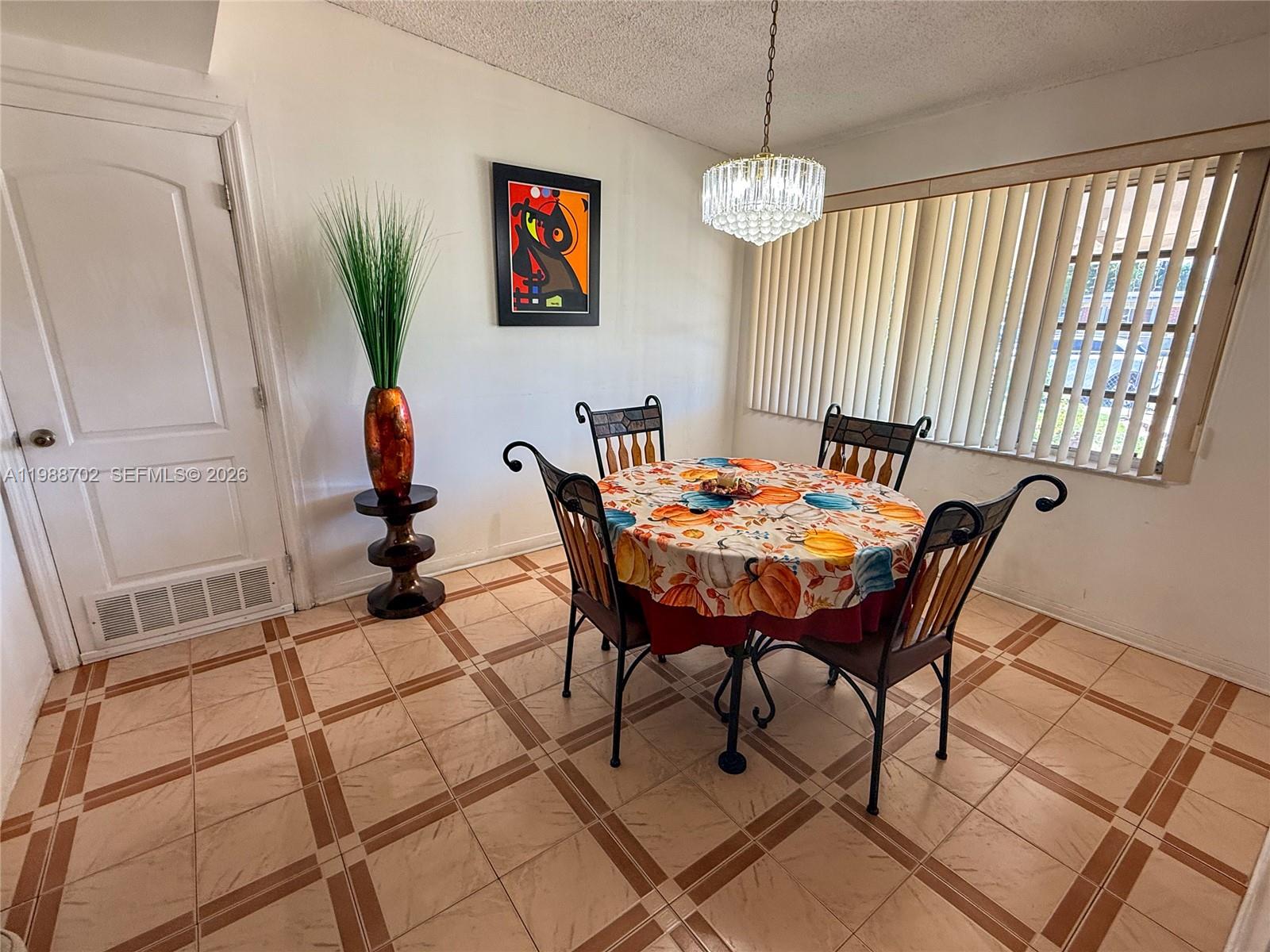9971 Southwest 41st Terrace Miami, FL 33165 - Photo 6 of 21 a dining room with furniture and window