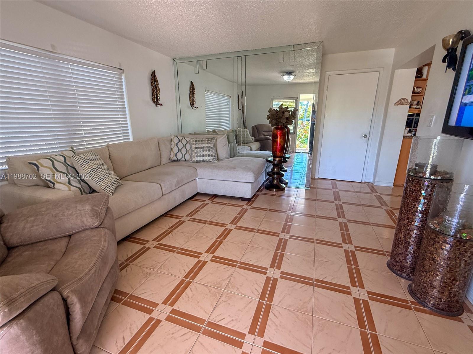 9971 Southwest 41st Terrace Miami, FL 33165 - Photo 8 of 21 a living room with furniture