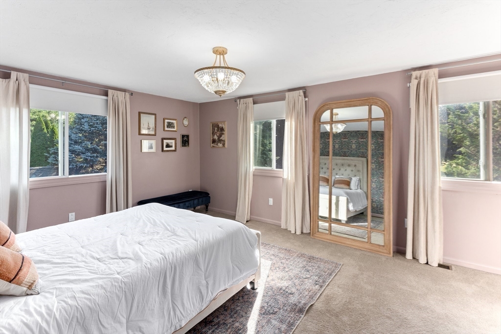 3 Forest Park Drive Mendon, MA 01756 - Photo 15 of 22 a bedroom with a large bed and a large window