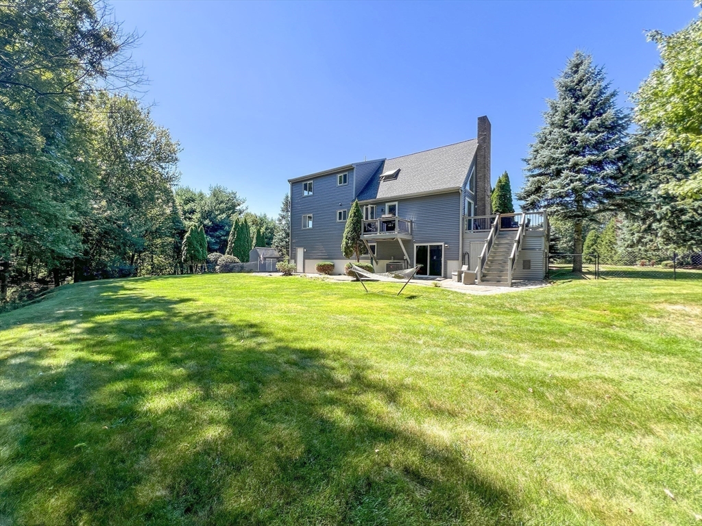 3 Forest Park Drive Mendon, MA 01756 - Photo 21 of 22 a view of a house with a yard