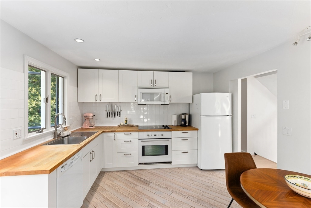 3 Forest Park Drive Mendon, MA 01756 - Photo 7 of 22 a kitchen with stainless steel appliances granite countertop a sink stove and refrigerator