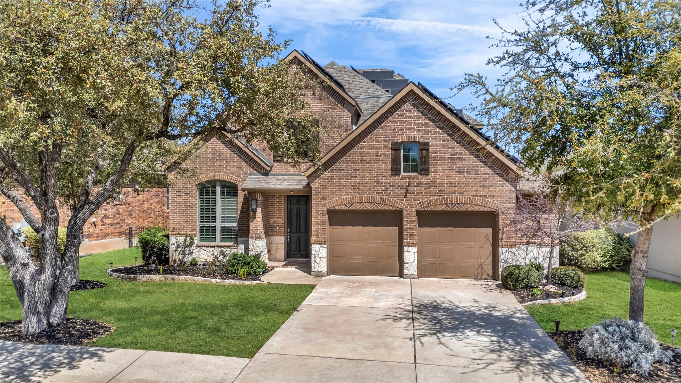 Brick and Stone with two-car garage.