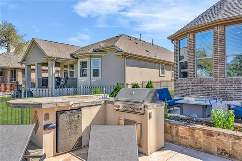 a outdoor space with lots of tables a large window and chairs