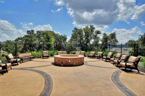 a view of swimming pool with outdoor seating