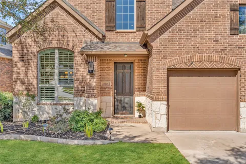 a dining room with furniture a rug and wooden floor