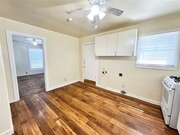 a view of a livingroom with wooden floor