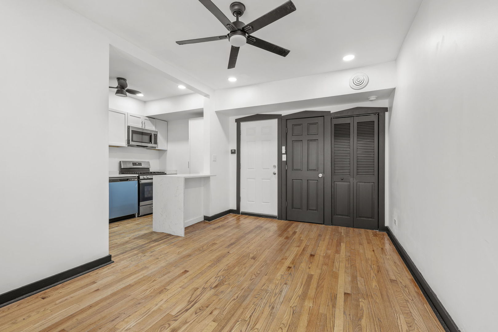 7202 South Indiana Avenue, Unit 1R Chicago, IL 60619 - Photo 3 of 9 a view of a kitchen with a sink and a refrigerator