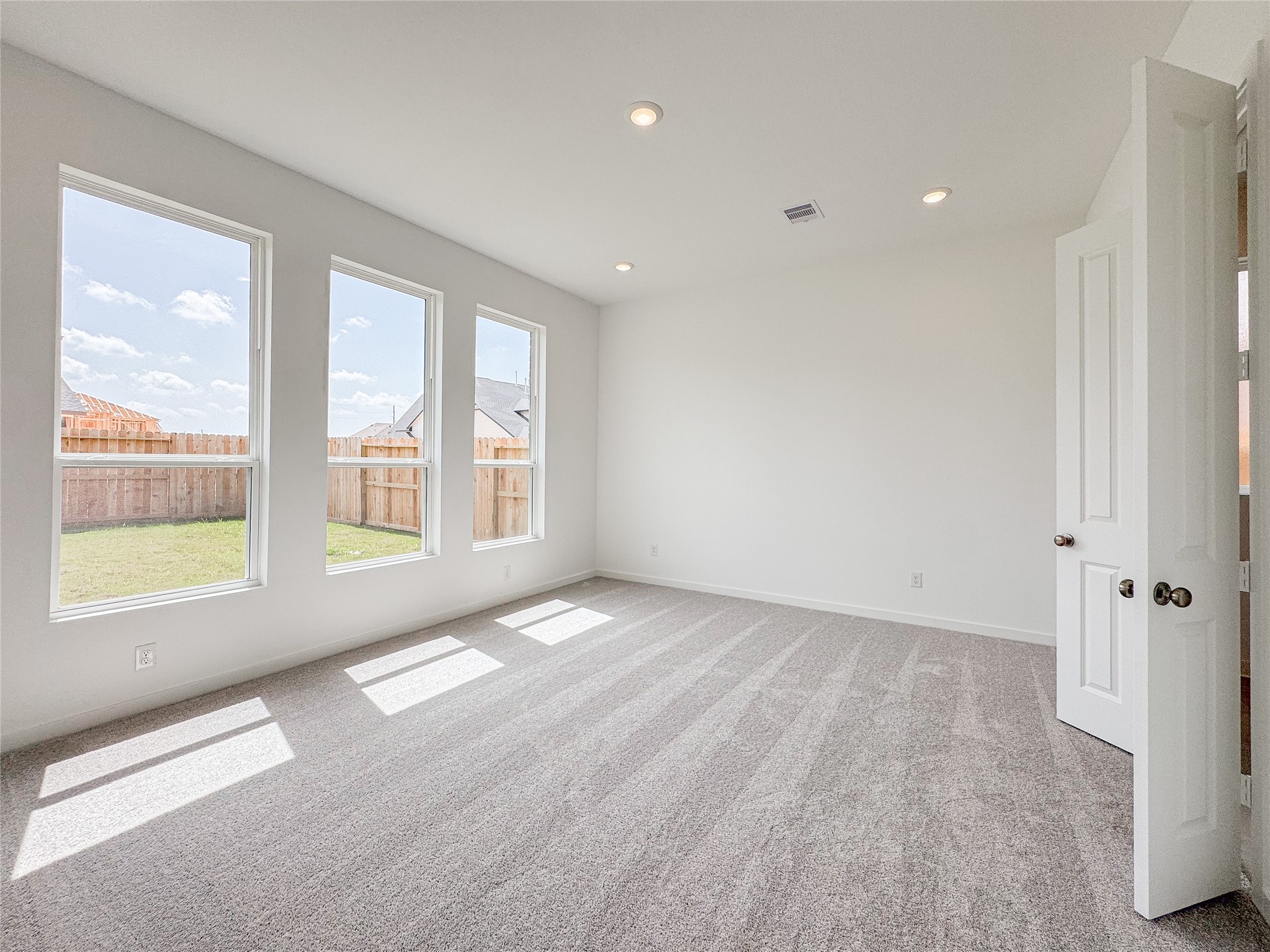 30939 Spring Lily Way Fulshear, TX 77423 - Photo 10 of 19 primary bedroom backs into the backyard with ample natural light
