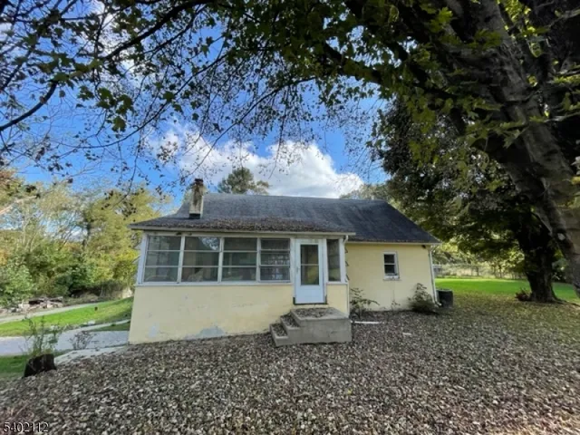 a house view with a backyard space