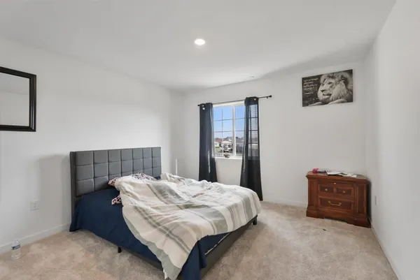 a bedroom with a bed and a closet