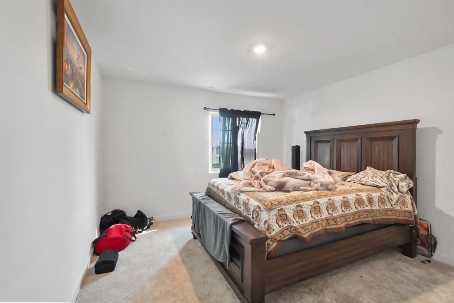 7041 Overlook Way Stockton, CA 95219 - Photo 16 of 31 a bedroom with a bed and a dresser