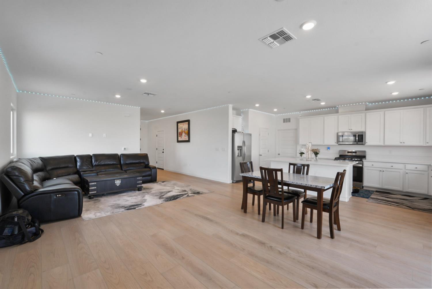 7041 Overlook Way Stockton, CA 95219 - Photo 19 of 31 a living room with furniture and kitchen view