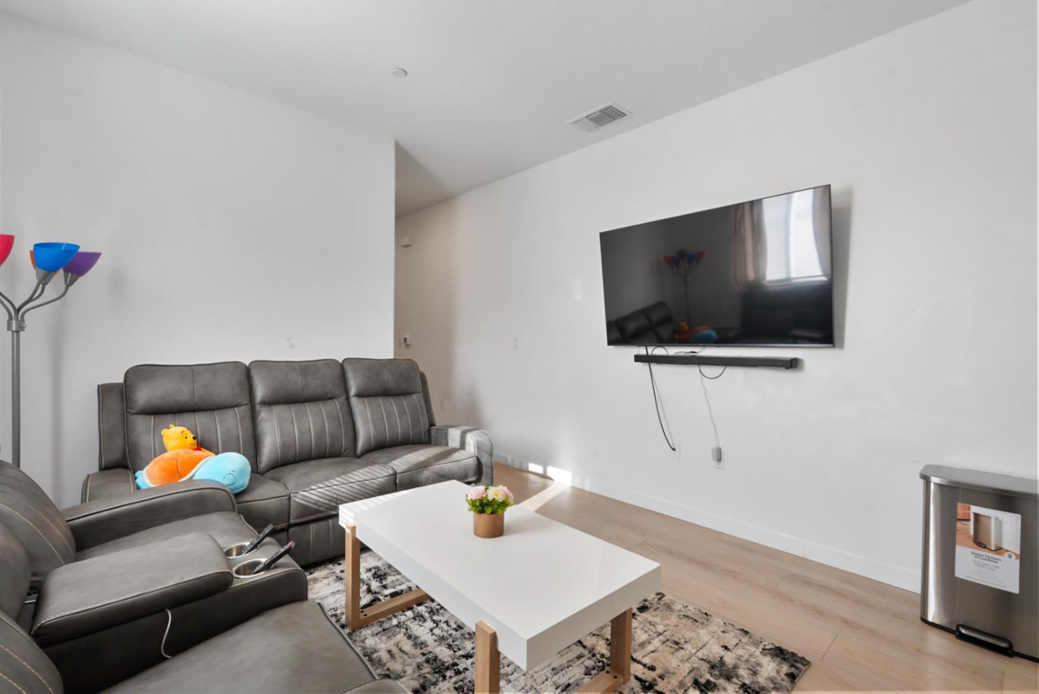 7041 Overlook Way Stockton, CA 95219 - Photo 28 of 31 a living room with furniture and a flat screen tv