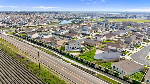 an aerial view of residential houses with outdoor space
