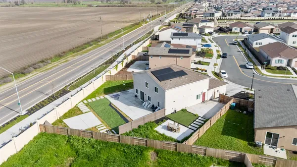 an aerial view of a house with a ocean view