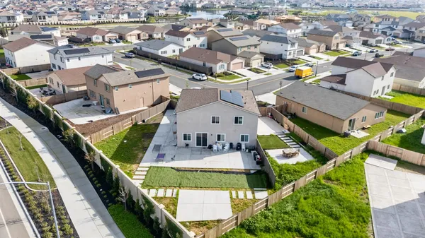 an aerial view of a house with a swimming pool