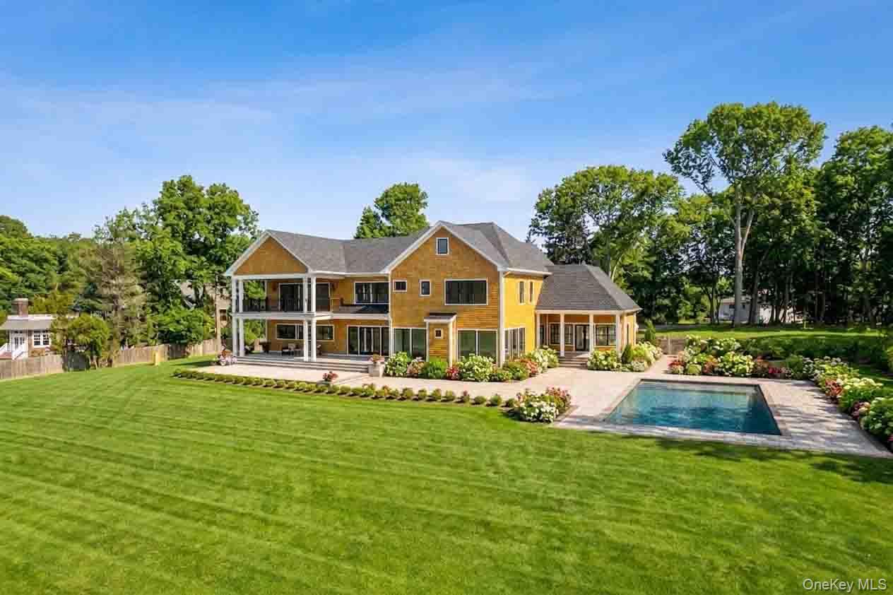 106 Cove Road Asharoken, NY 11768 - Photo 41 of 46 Rear view of house with an outdoor pool and a patio