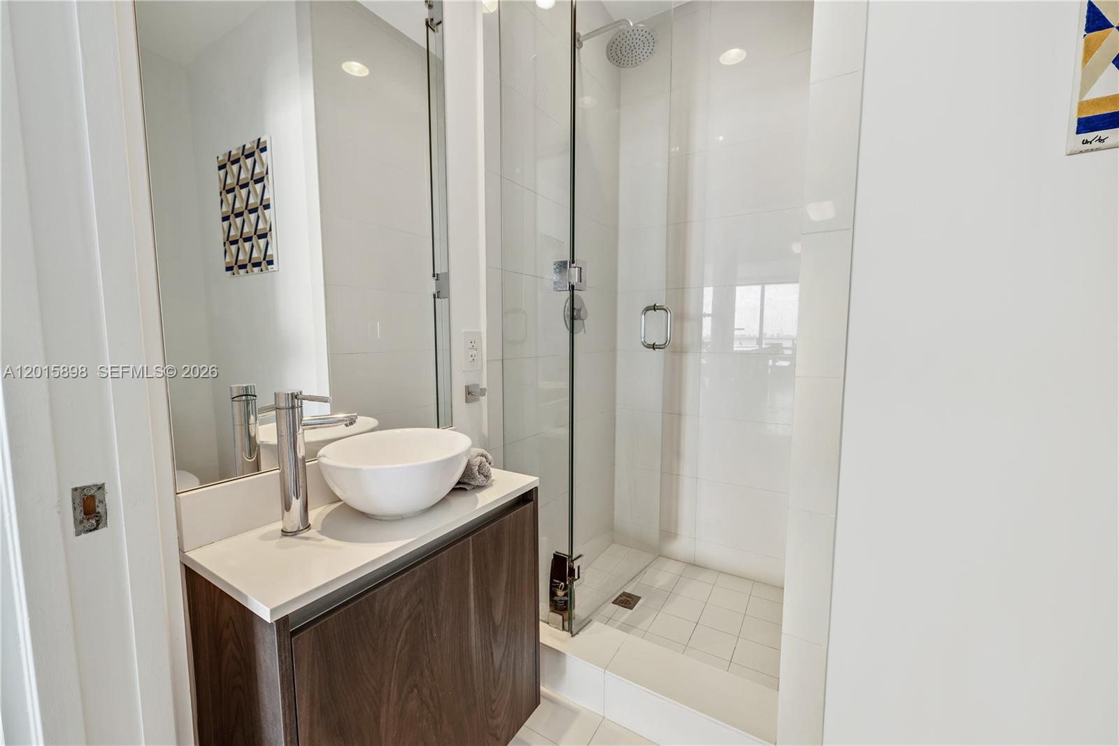 480 Northeast 31st Street, Unit 1802 Miami, FL 33137 - Photo 13 of 50 a bathroom with a sink a toilet and shower