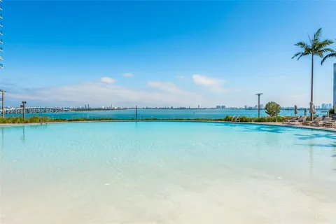 a view of outdoor space with seating area and swimming pool
