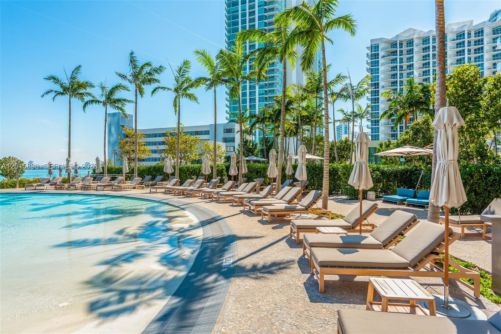 480 Northeast 31st Street, Unit 1802 Miami, FL 33137 - Photo 22 of 50 a view of outdoor space with seating area and swimming pool