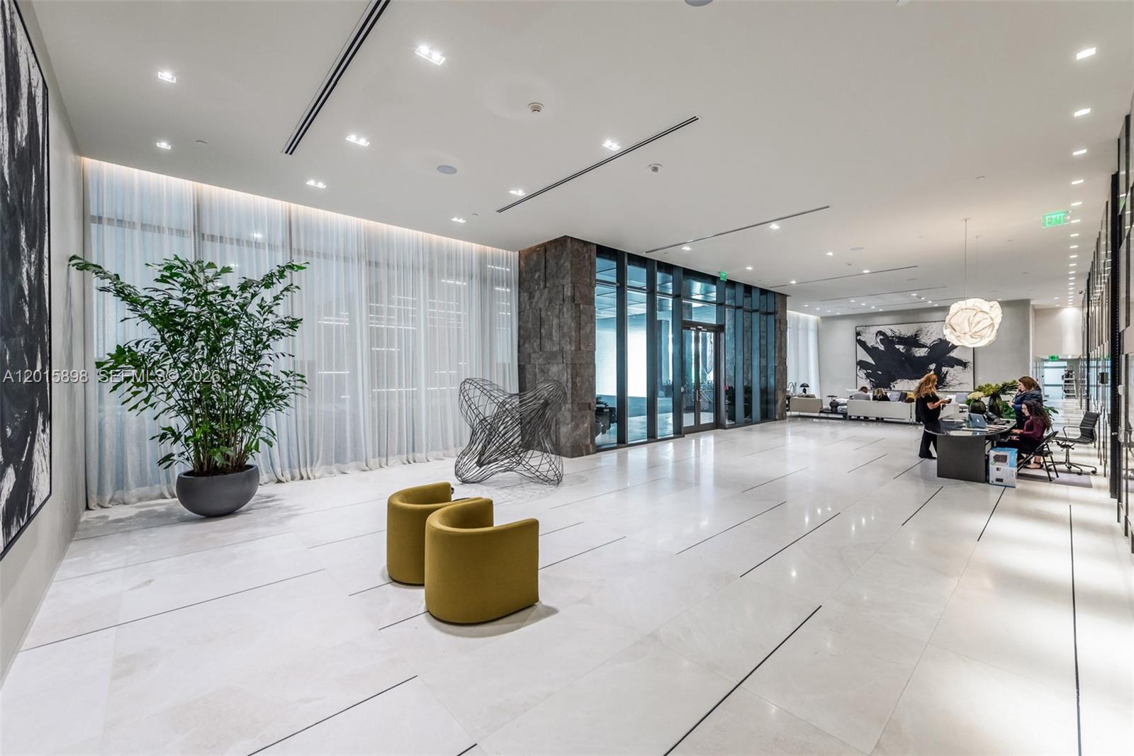 480 Northeast 31st Street, Unit 1802 Miami, FL 33137 - Photo 47 of 50 a lobby with furniture and potted plants