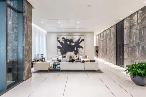 a view of a livingroom with an empty space and fireplace