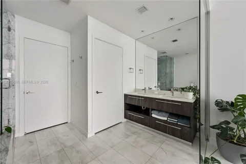 a view of bathroom with sink and mirror