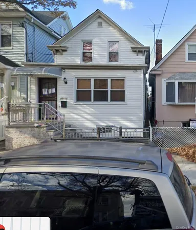 a front view of a house with a sitting space