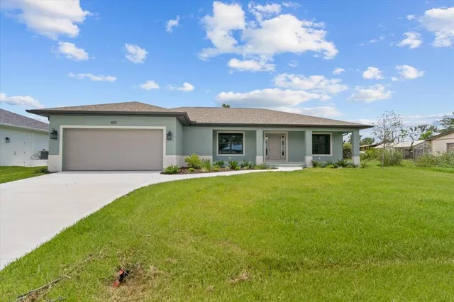 a view of house with yard outdoor seating and entertaining space