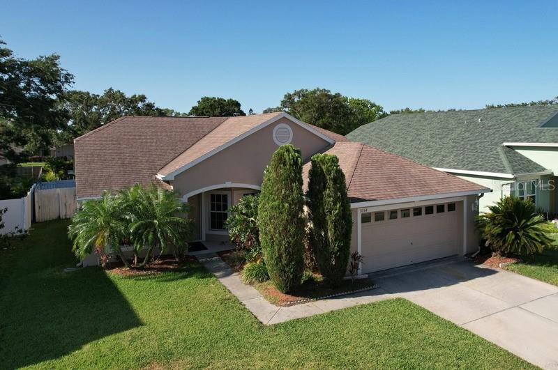 3054 Oakbrook Circle Clearwater, FL 33759 - Photo 1 of 1 a aerial view of a house with a yard