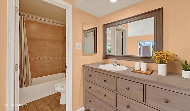 a bathroom with a toilet and shower