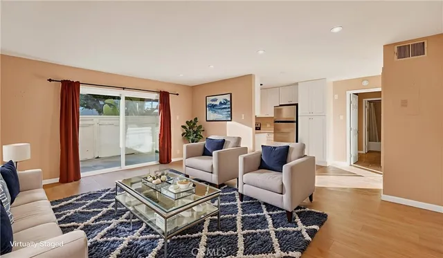 a living room with furniture and a rug