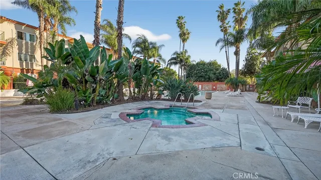 a view of a backyard with sitting area
