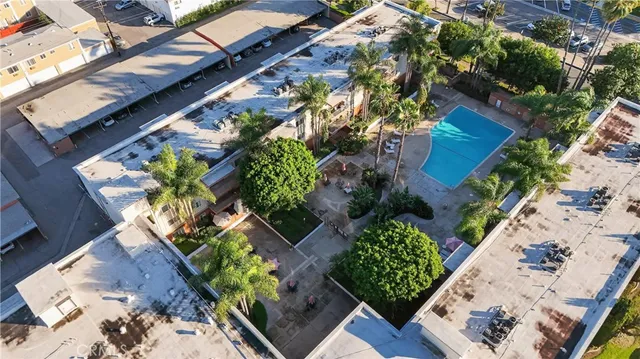 an aerial view of a house with a swimming pool yard and outdoor seating