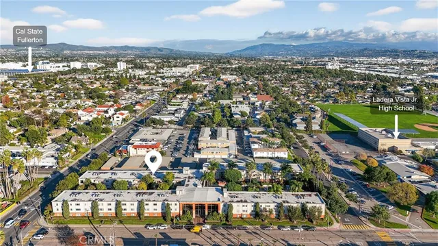 an aerial view of a city with lots of residential buildings