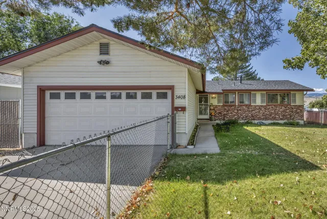 a view of house with a yard